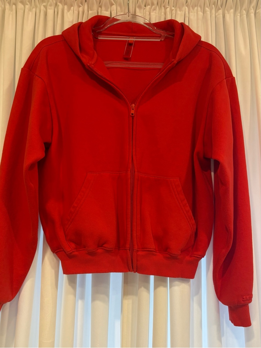 SKIMS 
Discontinued Red Fleece zip up Hoodie
